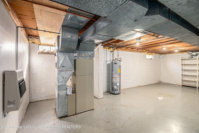 basement featuring gas water heater and heating unit