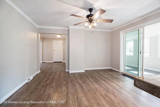 empty room with dark wood finished floors, crown molding, baseboards, and ceiling fan