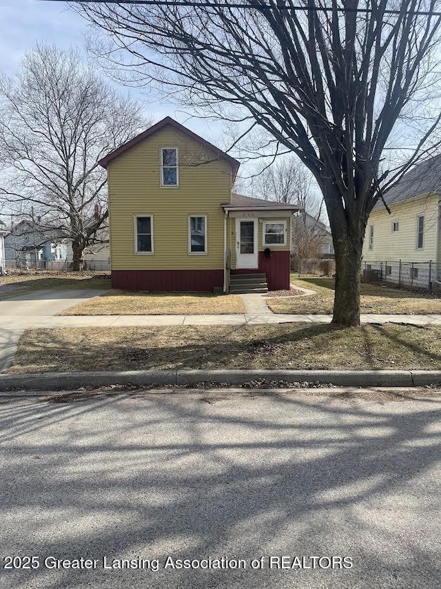 view of front of property with fence and entry steps