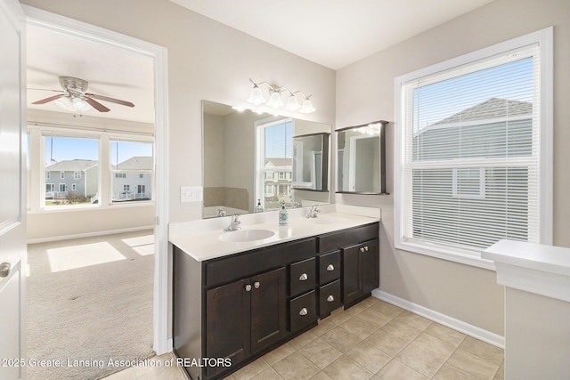 bathroom featuring a sink, a wealth of natural light, and a ceiling fan