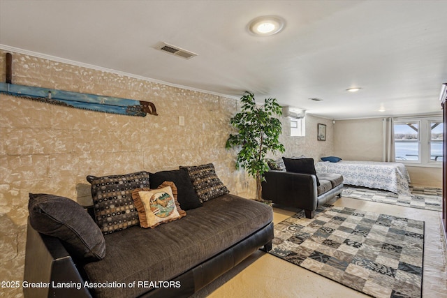 living area featuring visible vents, plenty of natural light, and ornamental molding