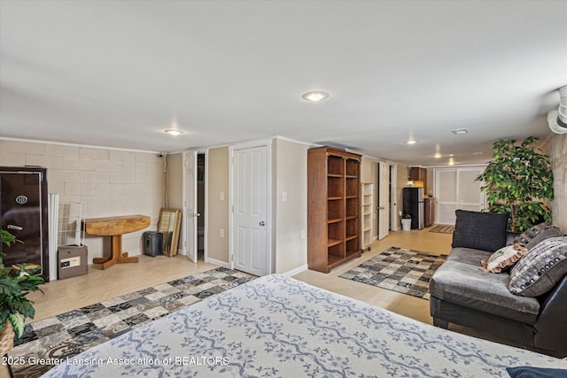 living room featuring concrete block wall