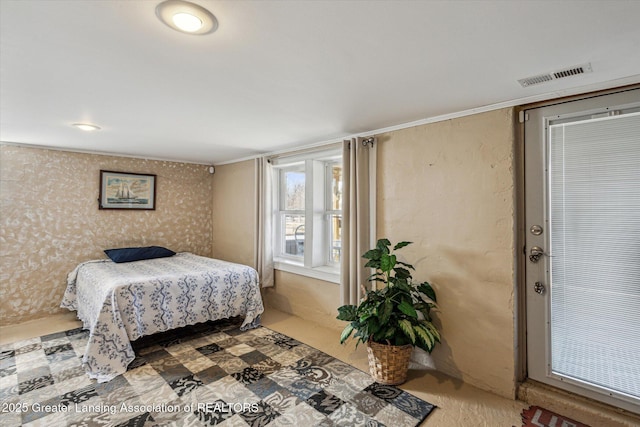 bedroom featuring visible vents and wallpapered walls