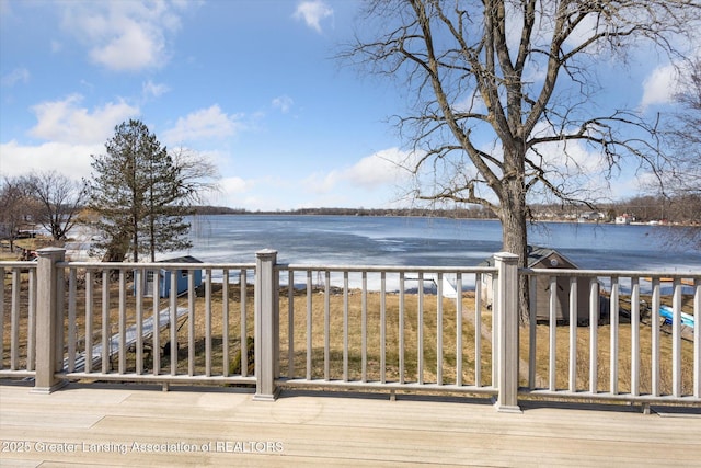 wooden deck with a water view