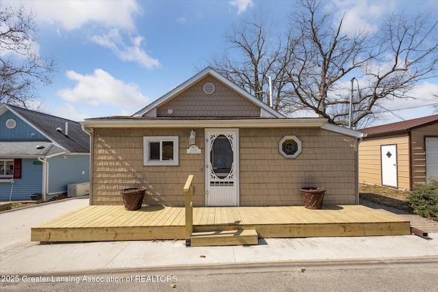 view of front of house with a wooden deck