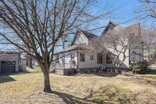 exterior space with a deck and a yard