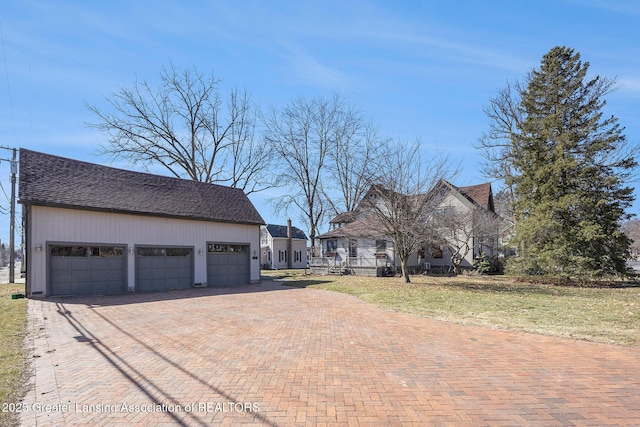 view of yard with decorative driveway
