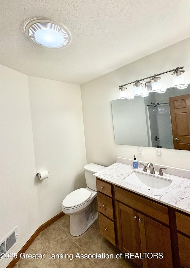 bathroom with vanity, visible vents, an enclosed shower, a textured ceiling, and toilet