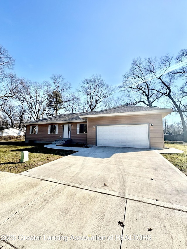 ranch-style house featuring driveway, a front lawn, and a garage