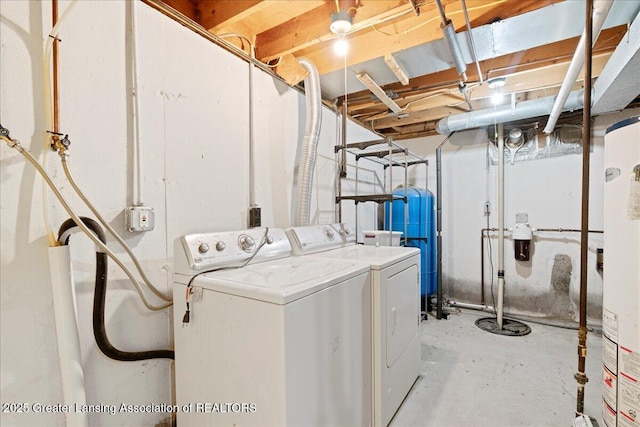 laundry area with laundry area, washer and dryer, and gas water heater