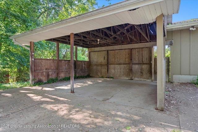 view of vehicle parking with a carport