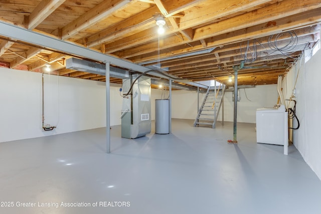 unfinished basement featuring heating unit, stairway, washer / dryer, and gas water heater