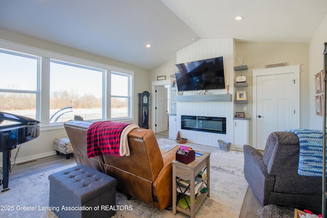 2860 Black Oak St, Webberville, MI 48892 - living area featuring visible vents, a fireplace, wood finished floors, recessed lighting, and lofted ceiling