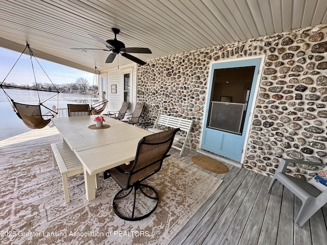 1793 N Shore Dr, Crystal, MI 48818 - wooden terrace with outdoor dining area and ceiling fan
