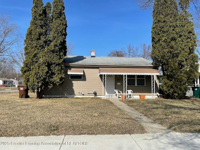 bungalow-style home with a porch and a front yard