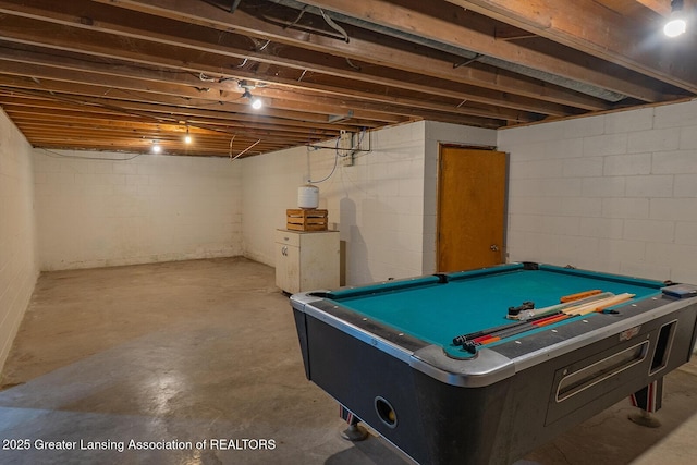 recreation room with unfinished concrete floors and billiards