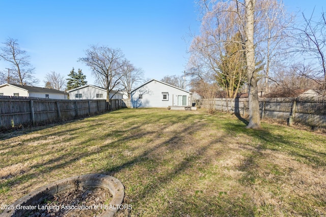 view of yard with a fenced backyard