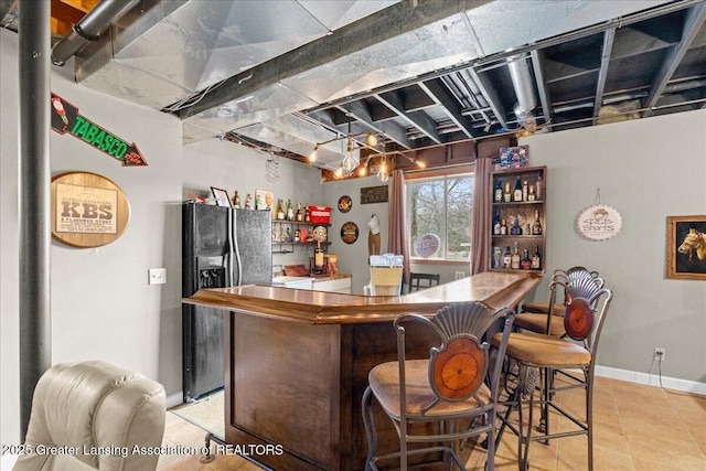 13305 Nelson, Bath, MI 48808 - bar with fridge with ice dispenser, light tile patterned floors, baseboards, and a dry bar