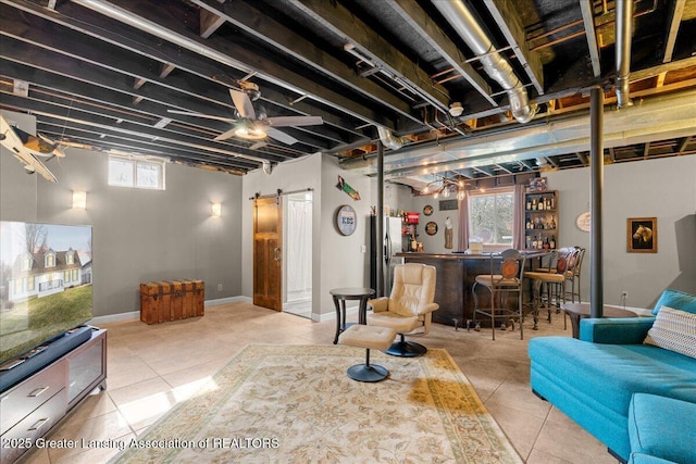 13305 Nelson, Bath, MI 48808 - living room with a bar, tile patterned floors, baseboards, and a barn door