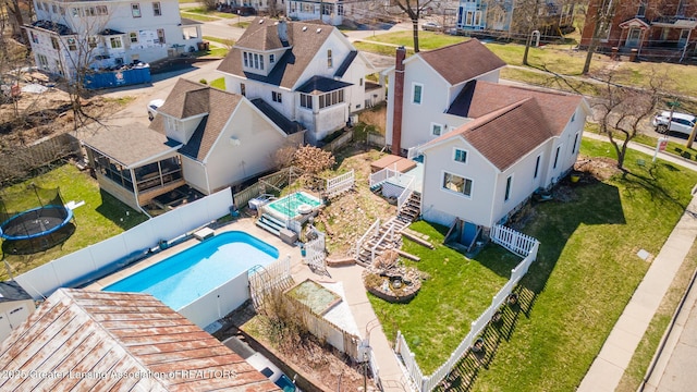 birds eye view of property with a residential view