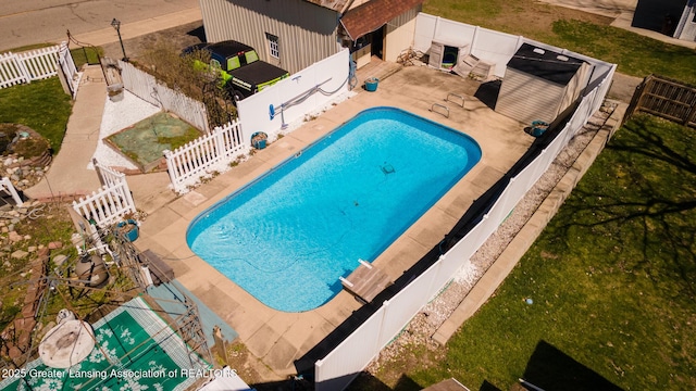 view of pool with a patio area, a fenced backyard, and a fenced in pool