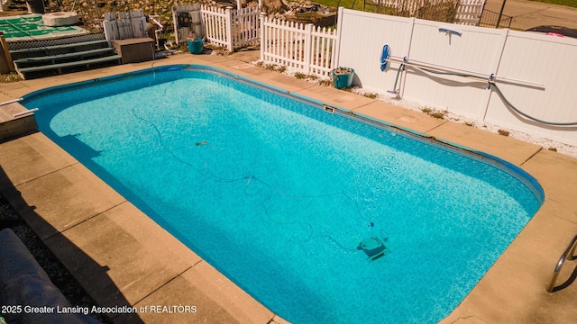 view of pool featuring a fenced in pool and fence