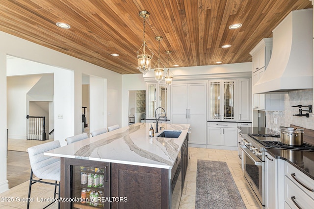 13600 Forest Hill Rd, Grand Ledge, MI 48837 - kitchen featuring high end stainless steel range, custom exhaust hood, a sink, wood ceiling, and recessed lighting