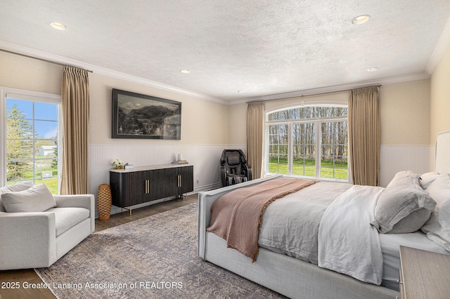 13600 Forest Hill Rd, Grand Ledge, MI 48837 - bedroom featuring wainscoting, wood finished floors, crown molding, recessed lighting, and a textured ceiling