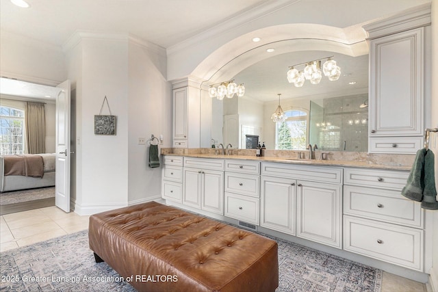 13600 Forest Hill Rd, Grand Ledge, MI 48837 - bathroom featuring a chandelier, double vanity, ornamental molding, plenty of natural light, and a shower stall