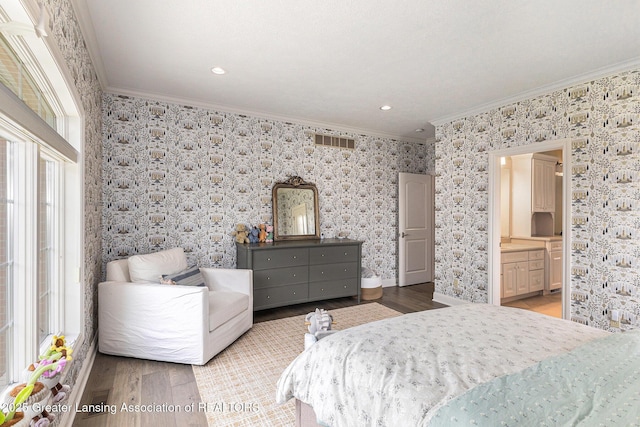 13600 Forest Hill Rd, Grand Ledge, MI 48837 - bedroom with crown molding, wood finished floors, multiple windows, wallpapered walls, and connected bathroom