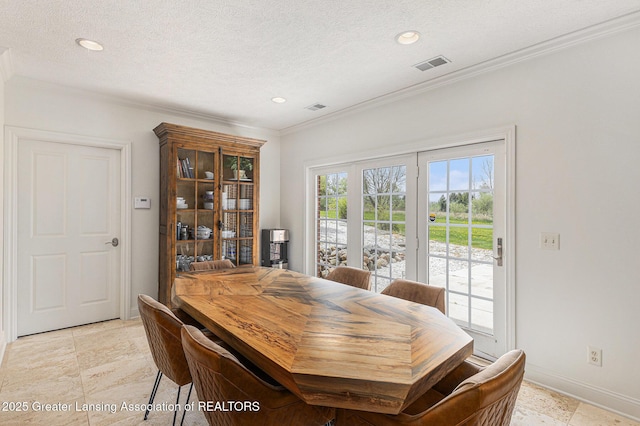 13600 Forest Hill Rd, Grand Ledge, MI 48837 - dining area with crown molding, a textured ceiling, baseboards, and recessed lighting