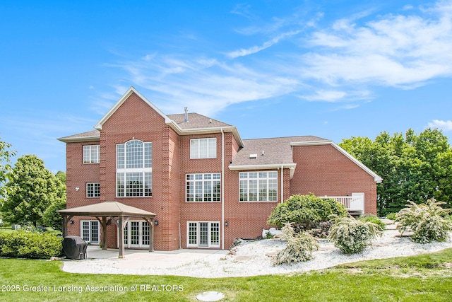 13600 Forest Hill Rd, Grand Ledge, MI 48837 - back of house with a gazebo, french doors, a patio, and brick siding