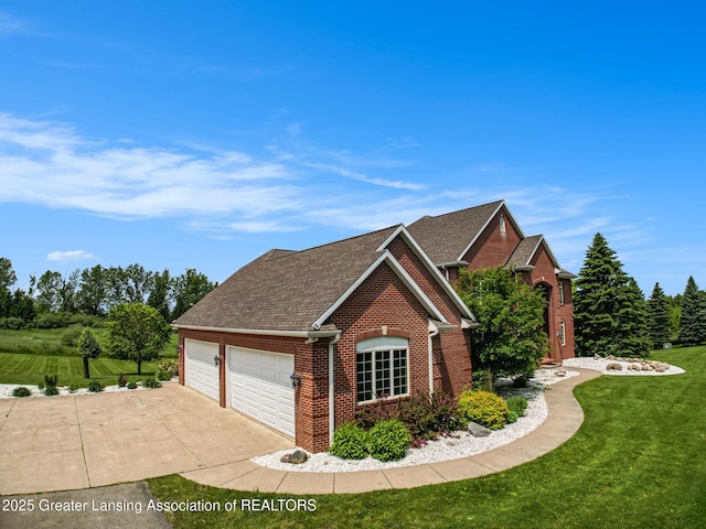 13600 Forest Hill Rd, Grand Ledge, MI 48837 - view of front of property with brick siding, a front yard, concrete driveway, an attached garage, and a shingled roof