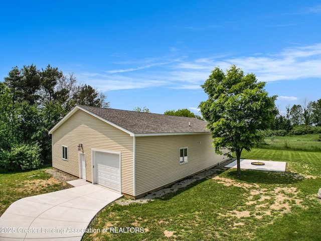 13600 Forest Hill Rd, Grand Ledge, MI 48837 - view of property exterior with a yard, a detached garage, driveway, and a shingled roof
