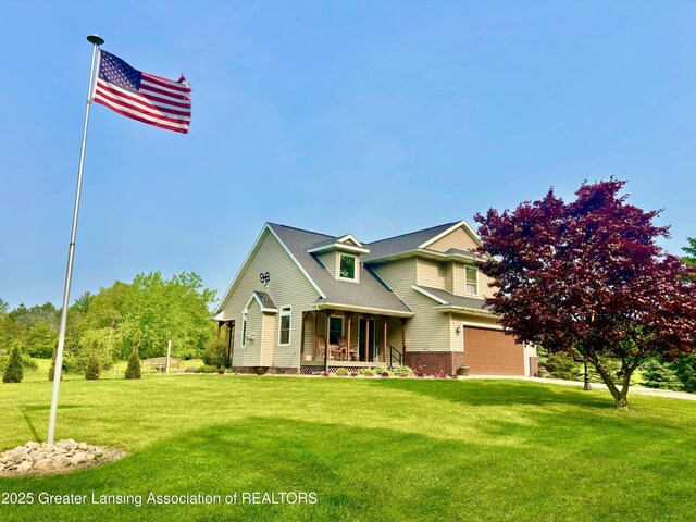 8464 W Howe Rd, Eagle, MI 48822 - view of front of home with covered porch, a garage, and a front lawn