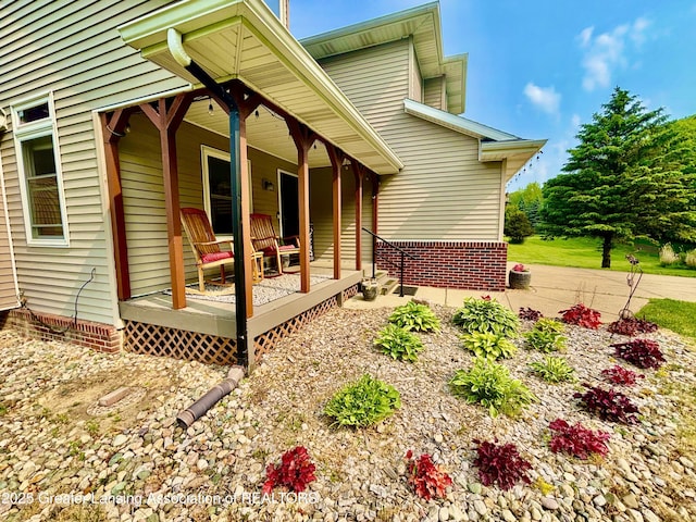 8464 W Howe Rd, Eagle, MI 48822 - view of home's exterior with a porch