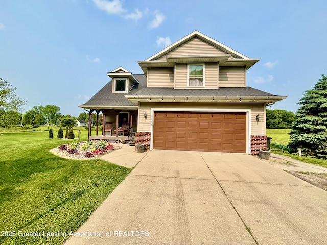 8464 W Howe Rd, Eagle, MI 48822 - view of front facade with a porch, brick siding, an attached garage, a front lawn, and concrete driveway