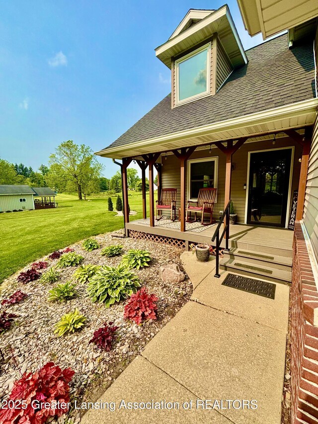 8464 W Howe Rd, Eagle, MI 48822 - covered porch with a lawn