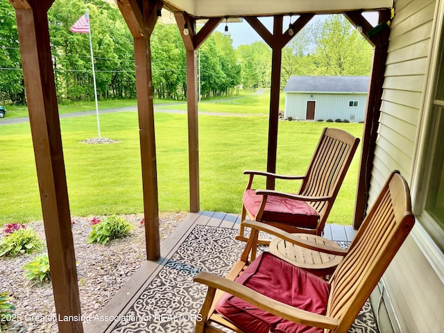 8464 W Howe Rd, Eagle, MI 48822 - view of patio / terrace with view of wooded area