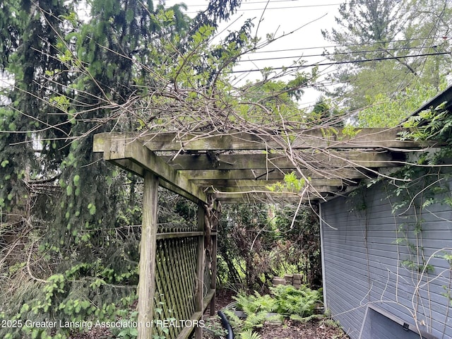 909 Britten Ave, Lansing, MI 48910 - view of home's exterior with a pergola