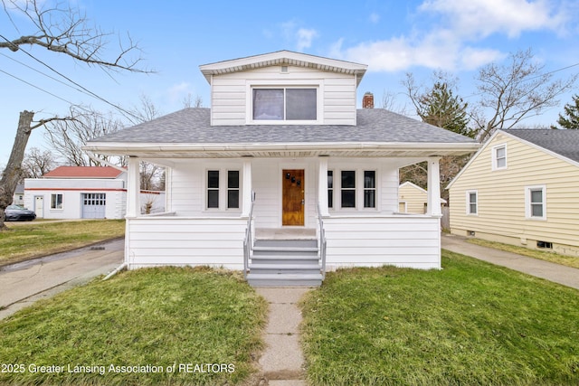 bungalow-style house featuring covered porch, a shingled roof, and a front lawn