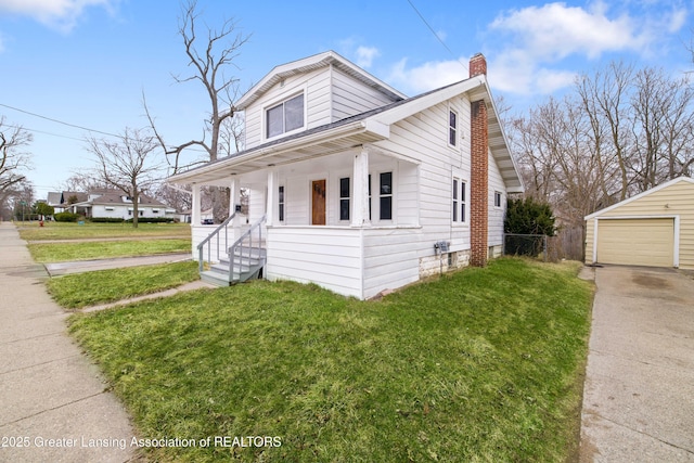 bungalow-style home featuring an outbuilding, a chimney, a front lawn, and a porch