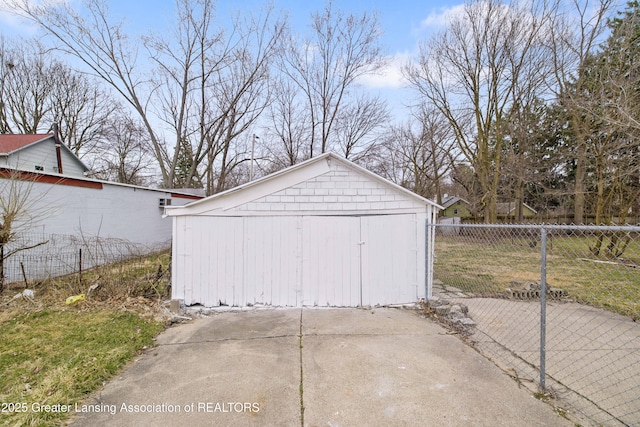 view of outbuilding featuring fence and an outdoor structure