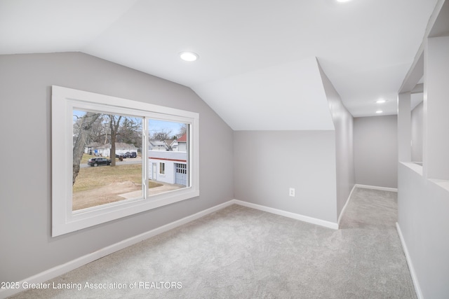 bonus room featuring baseboards, lofted ceiling, carpet floors, and recessed lighting