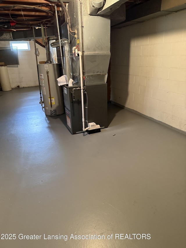 831 Jackson St, Eaton Rapids, MI 48827 - below grade area featuring water heater and heating unit