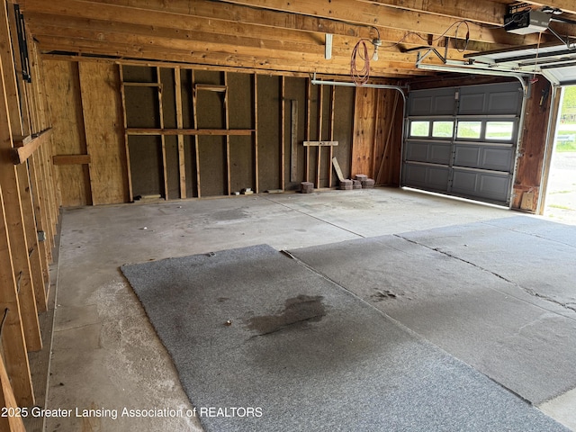 831 Jackson St, Eaton Rapids, MI 48827 - garage featuring a garage door opener