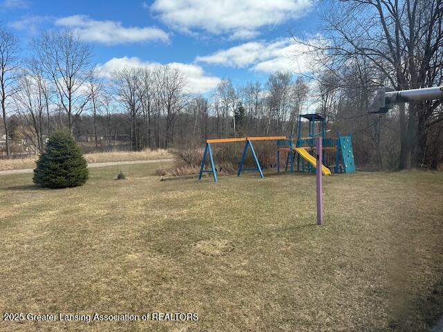 464 N Rolland Rd, Weidman, MI 48893 - view of jungle gym featuring a yard