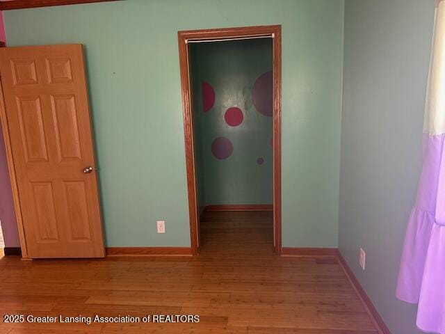 464 N Rolland Rd, Weidman, MI 48893 - empty room with light wood finished floors and baseboards