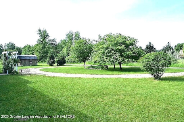 464 N Rolland Rd, Weidman, MI 48893 - view of home's community featuring a yard