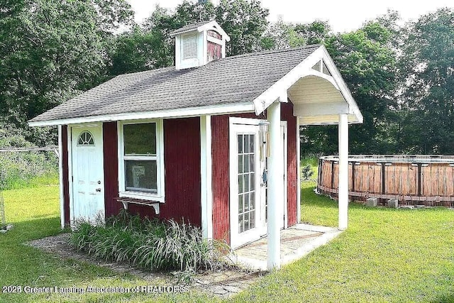 464 N Rolland Rd, Weidman, MI 48893 - view of outdoor structure with a jacuzzi and an outdoor structure